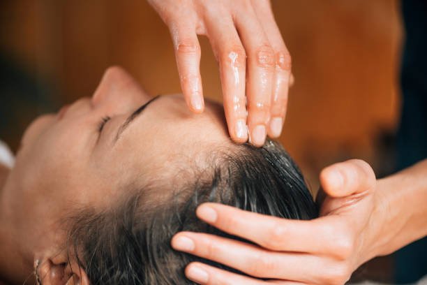 Couple enjoying luxury spa packages in Dubai with relaxing massages and aromatherapy in a romantic setting.